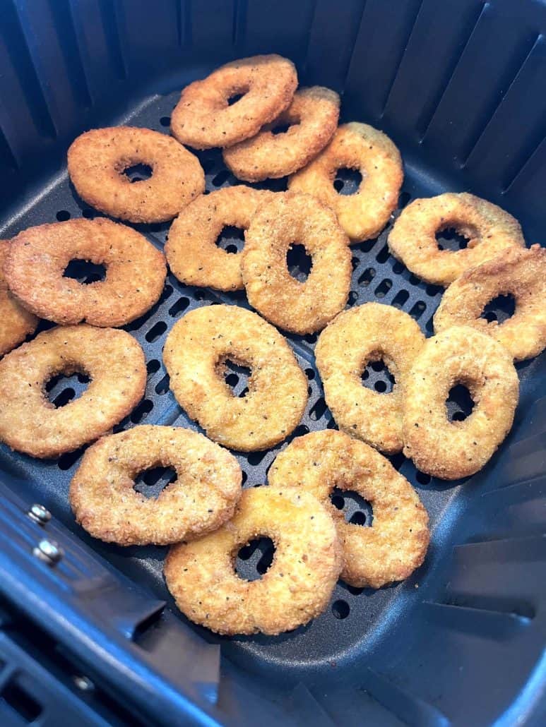 Golden, crispy White Castle chicken rings freshly cooked in an air fryer, ready to enjoy.