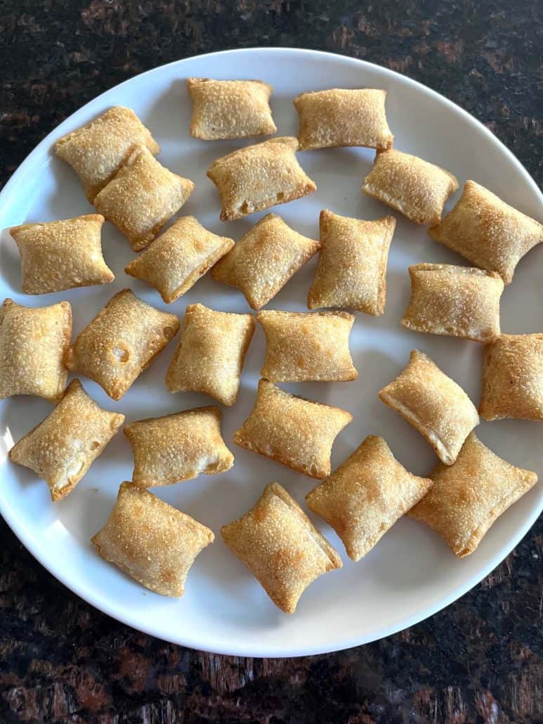 Plate filled with golden and crispy Totino's Breakfast Snack Bites, ready to enjoy.