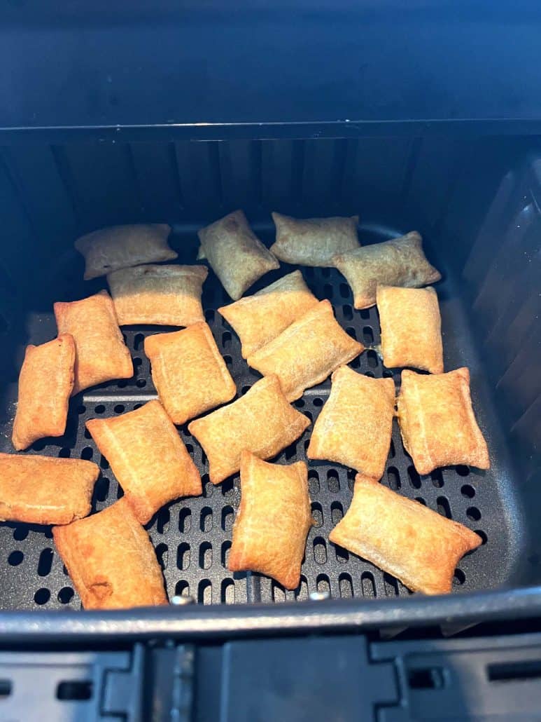 Close-up of an air fryer basket filled with golden-brown White Castle Cheeseburger Bites, emphasizing their crispy texture and ready-to-eat appearance for a quick and delicious snack.