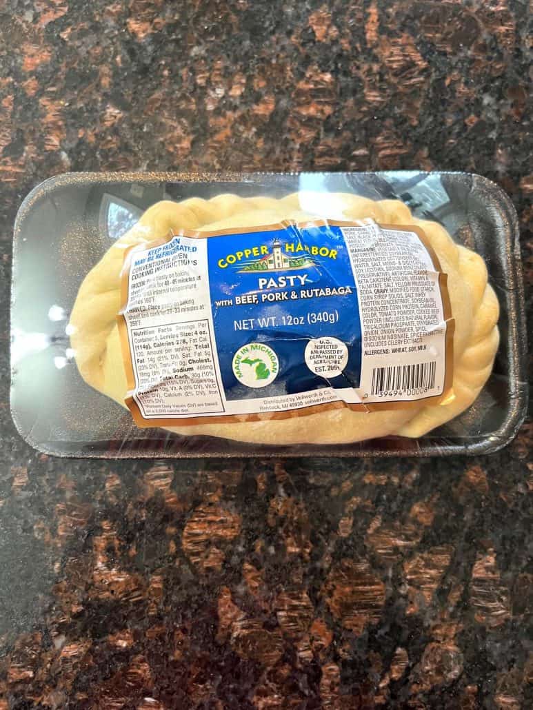 A packaged frozen pasty on a kitchen counter, ready to be cooked in the air fryer for a quick and easy meal.