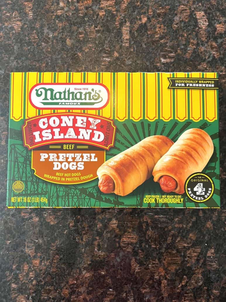 Box of Nathan’s Coney Island frozen pretzel dogs on a kitchen countertop.