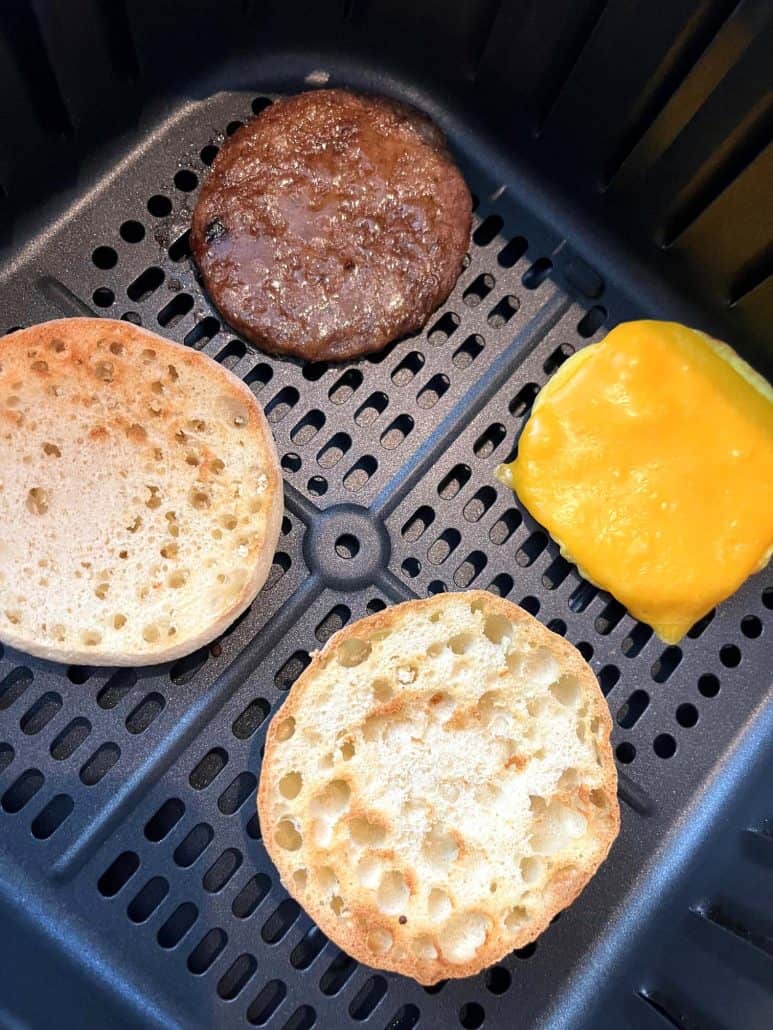 Deconstructed Jimmy Dean English Muffin Sandwich in an air fryer basket, for a crispy, delicious breakfast.