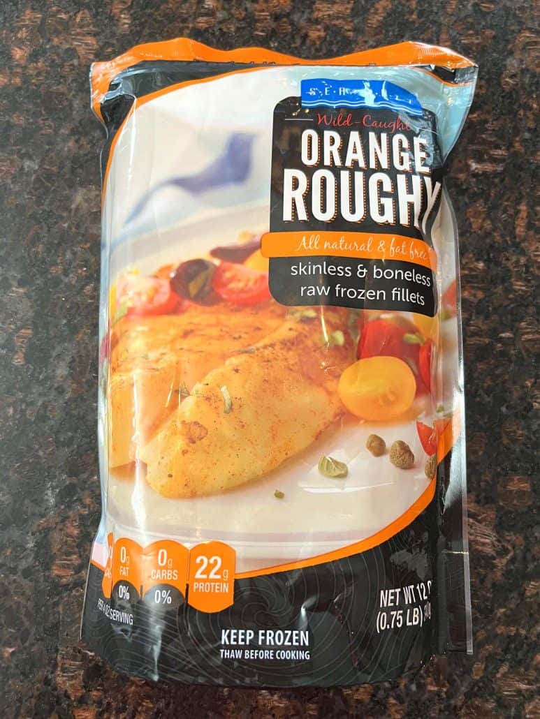 A package of frozen orange roughy fillets, the key ingredient for this easy air fryer recipe that cooks straight from frozen.