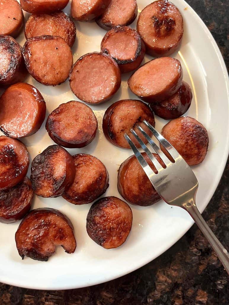 Freshly cooked, ring bologna slices ready to be served.