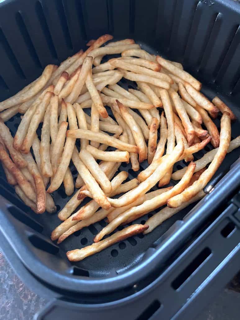 Crispy McCain Beer Battered Fries freshly cooked in the air fryer basket.